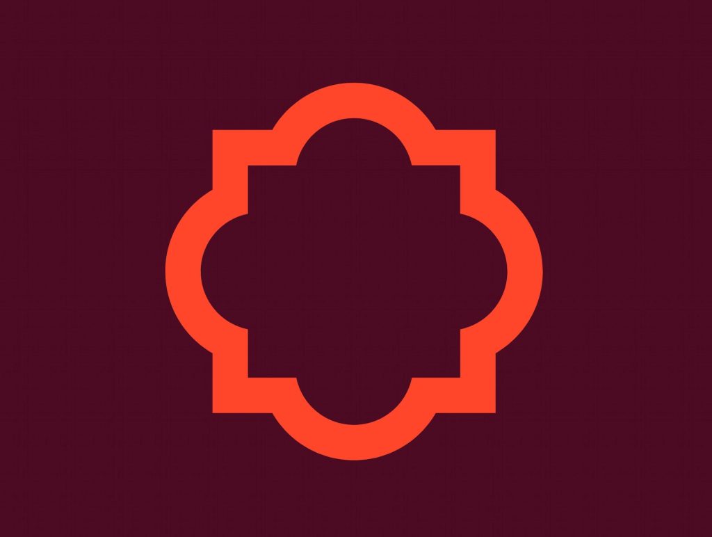 En orange symbol, ett så kallat fyrpass mot vinröd bakgrund.